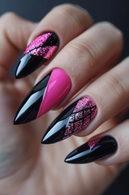 Stiletto nails with hot pink and black design and glitter details.