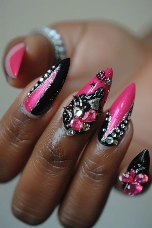 Hot pink nails with elaborate silver glitter and gemstone embellishments.