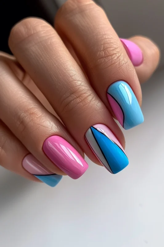 Square nails with pink, blue, and black design.