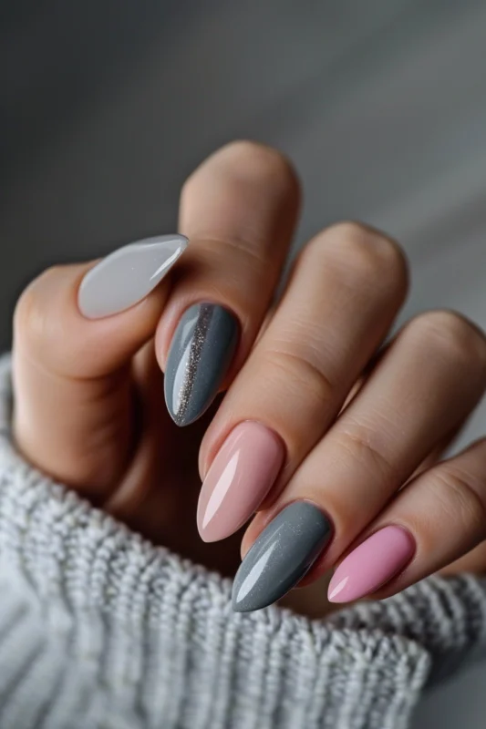 Pink and grey nails with a shimmering stripe.