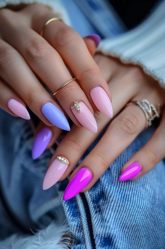 Stiletto nails in alternating pink and purple hues.