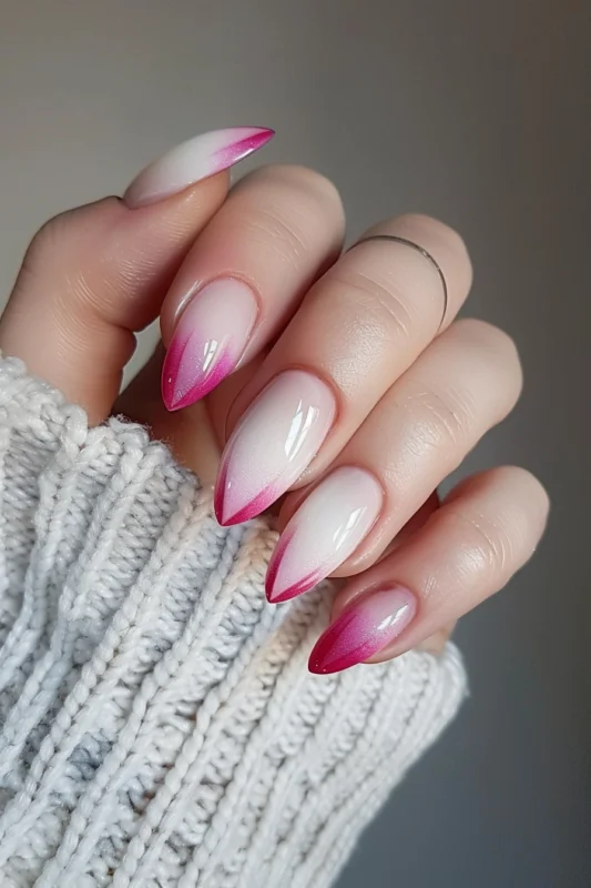 Nails with a pink and white ombre effect.