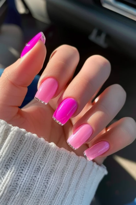 Square nails with a glossy pink base and transparent French tips.