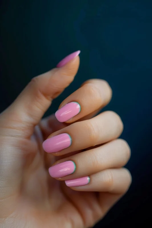 Short pink nails with green accent lines.