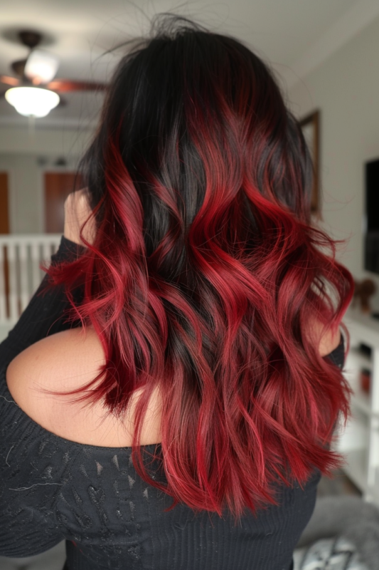 Black hair with a ruby red ombre effect.