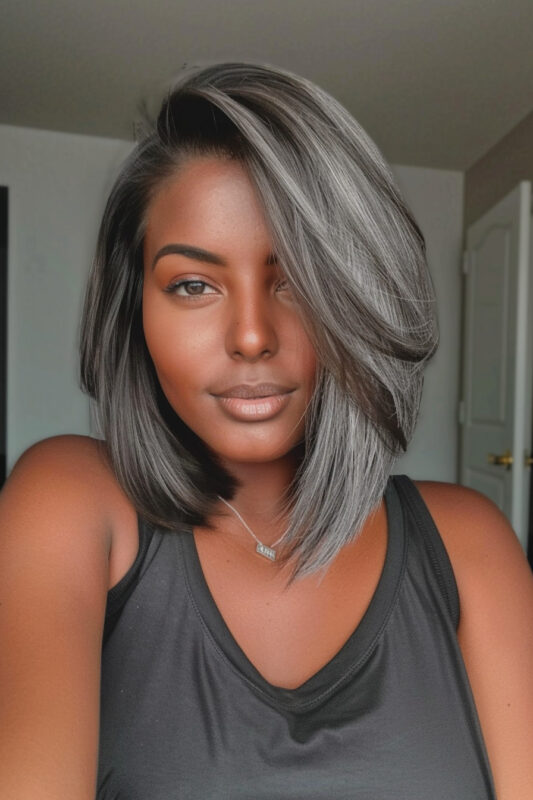 A woman with an ash grey bob haircut.