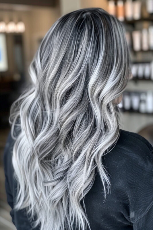 Hair with black roots blending into dark ash grey and silver highlights naturally.
