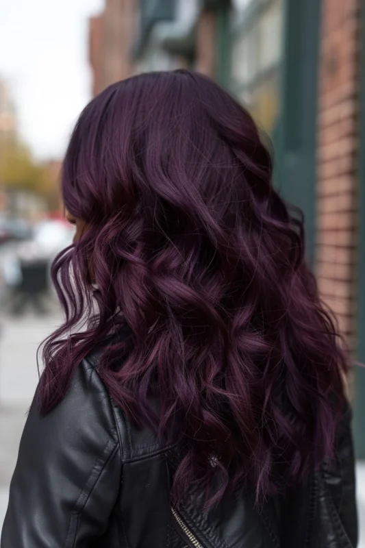 Woman with a dark plum hair color