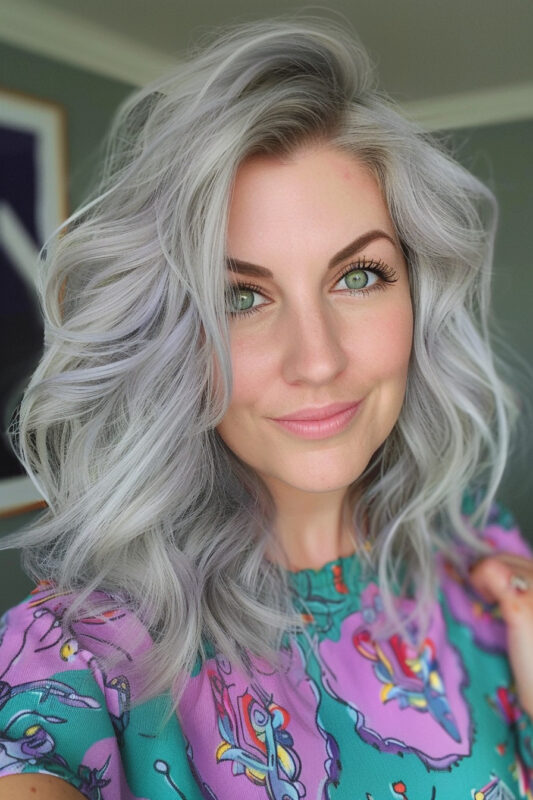 Woman with shoulder-length silver hair styled in loose waves.