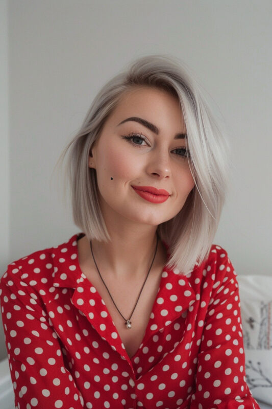 Woman with a silver-blonde bob.