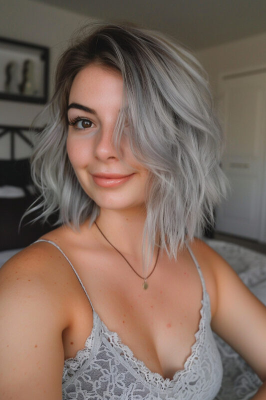 Woman with a textured silver bob haircut