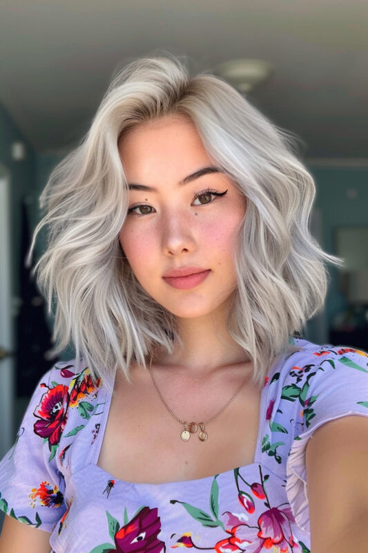 Woman with a wavy silver bob haircut