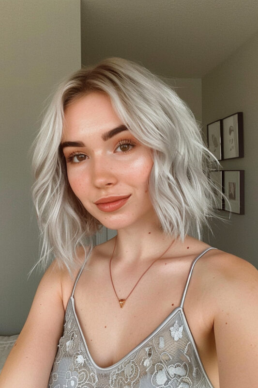 Woman with a textured silver bob haircut