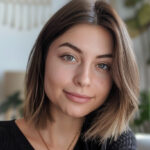 Woman with light brown shoulder length haircut.