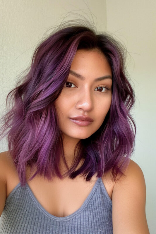 Woman with wavy shoulder length hair.