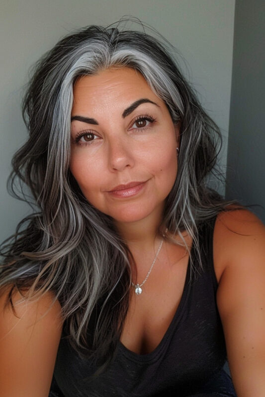 Woman with black hair going grey.