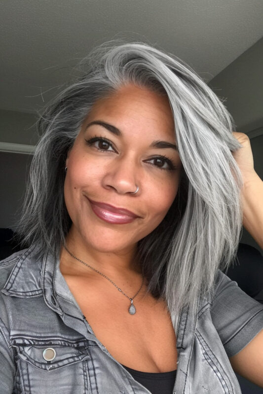 Woman showing a full transition to grey hair.