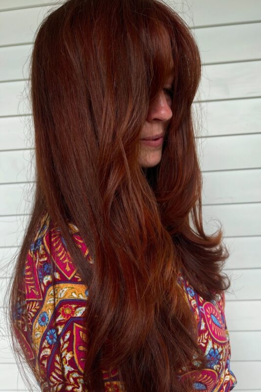 A woman with an amber brown hair color.