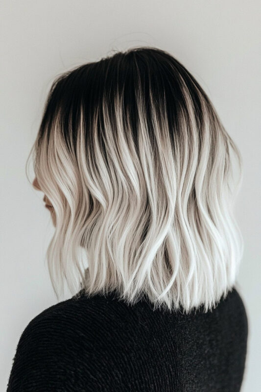 Woman with black hair and an icy pearl ombre.