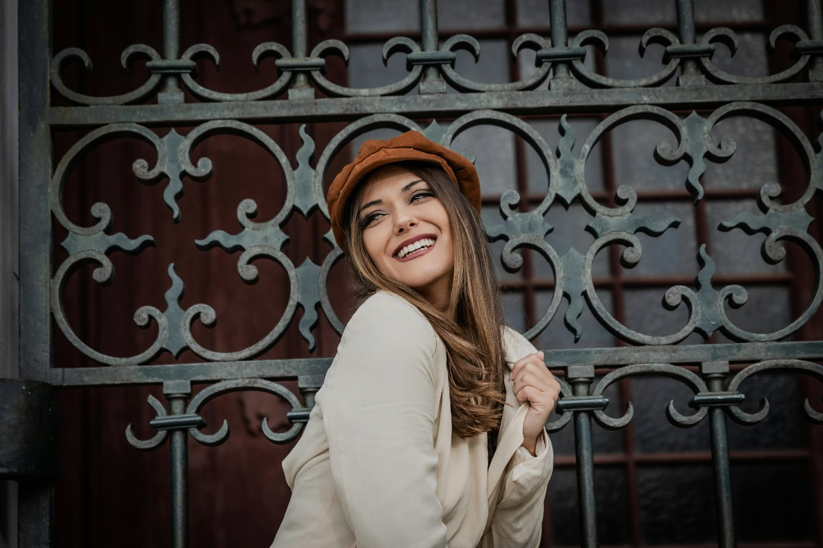 Photo of a woman with brown hair and light highlights.