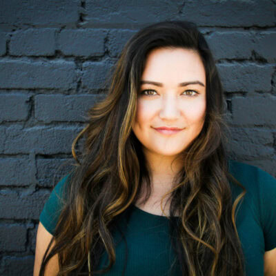 Woman with a blonde balayage on her brunette hair.