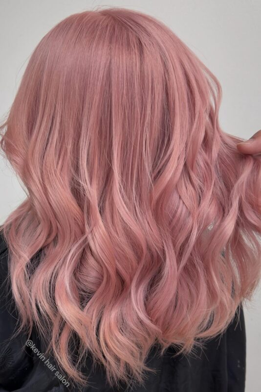 Woman with bubblegum pink hair.