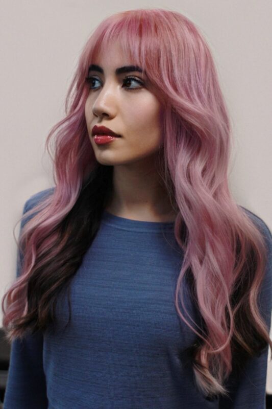 Woman with a cotton candy hair color.