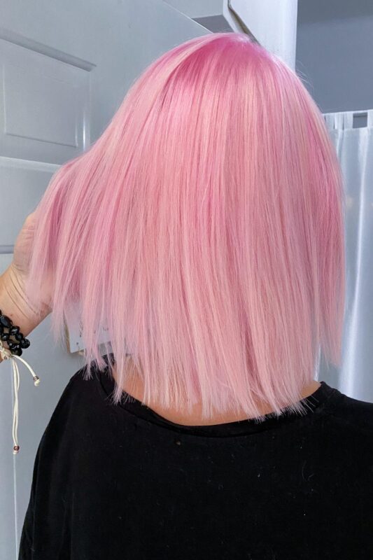 Woman with cotton candy pink hair.