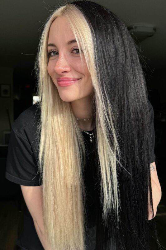 Woman with a half black, half platinum hair color.