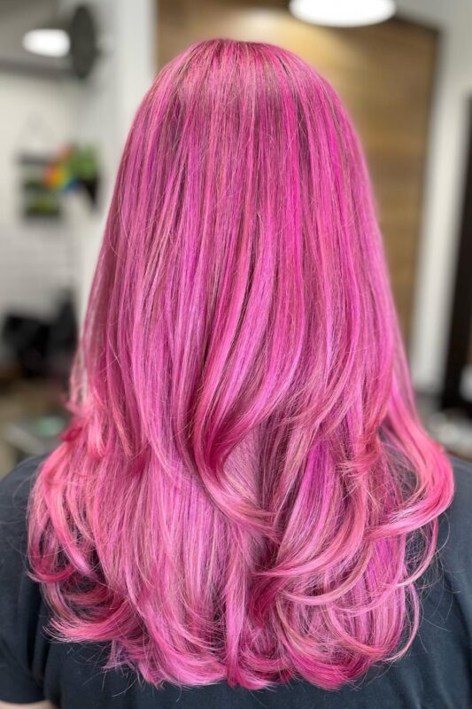 Woman with hot pink hair.