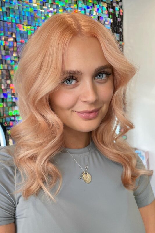 Woman with a light peach hair color.