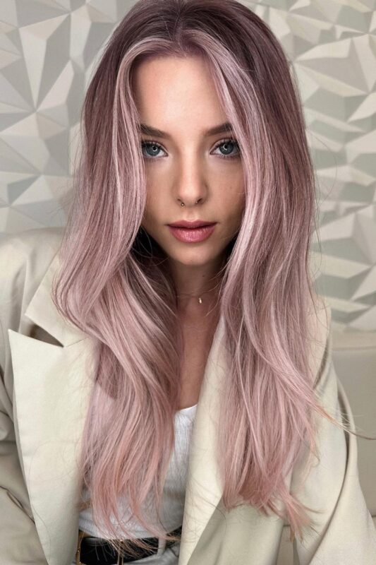 Woman with a light pink balayage.