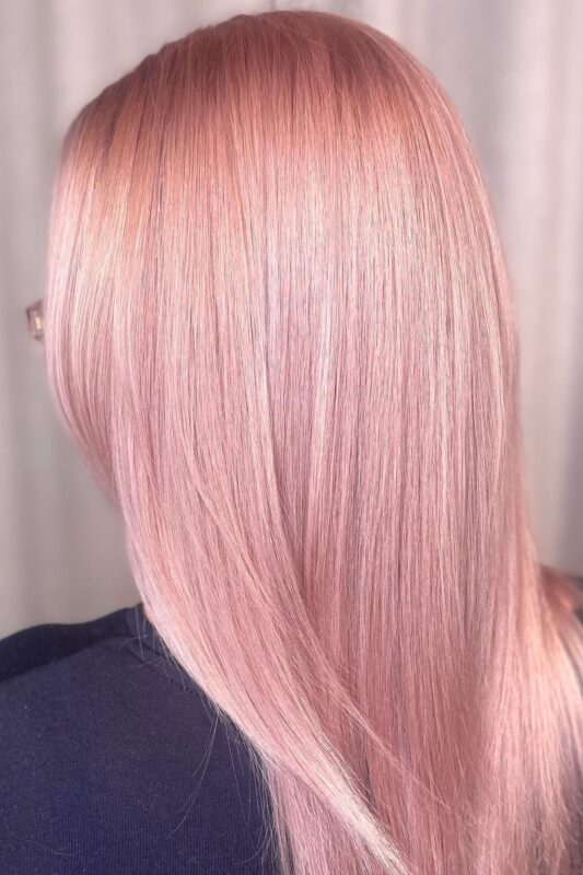 Woman with light rose gold blonde hair.