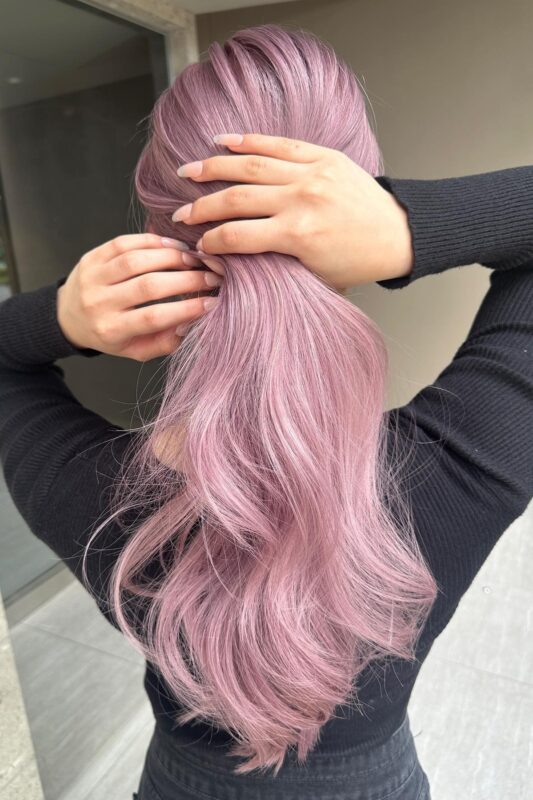 Woman with a purplish pink hair dye.