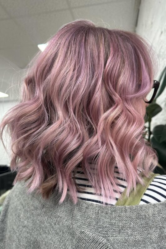 Woman with smoky pink lavender hair.