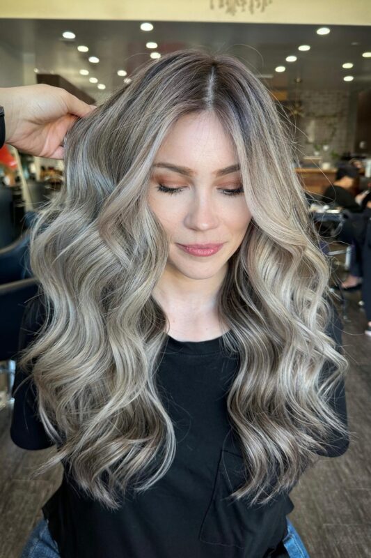 Woman with an ash blonde hair color.