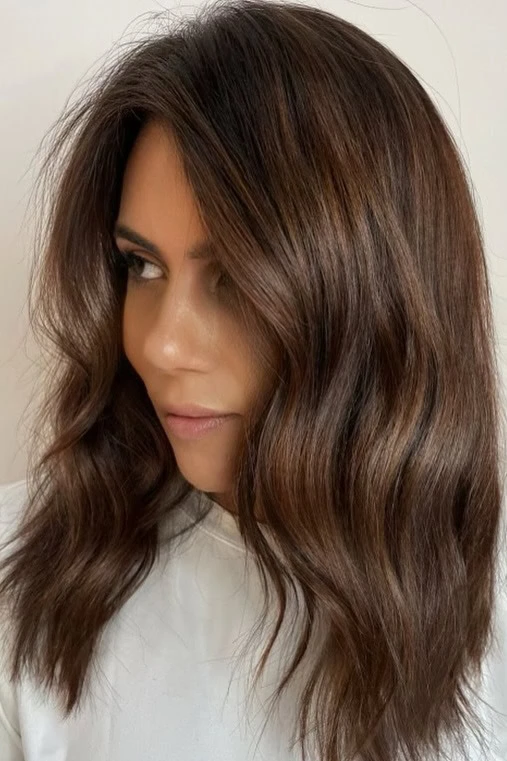 Woman with a chocolate brown balayage.