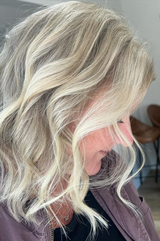 Blonde highlights seamlessly covering gray on blonde hair.