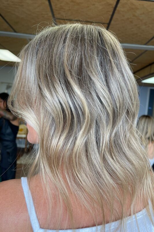 A natural look with golden blonde highlights to hide gray.