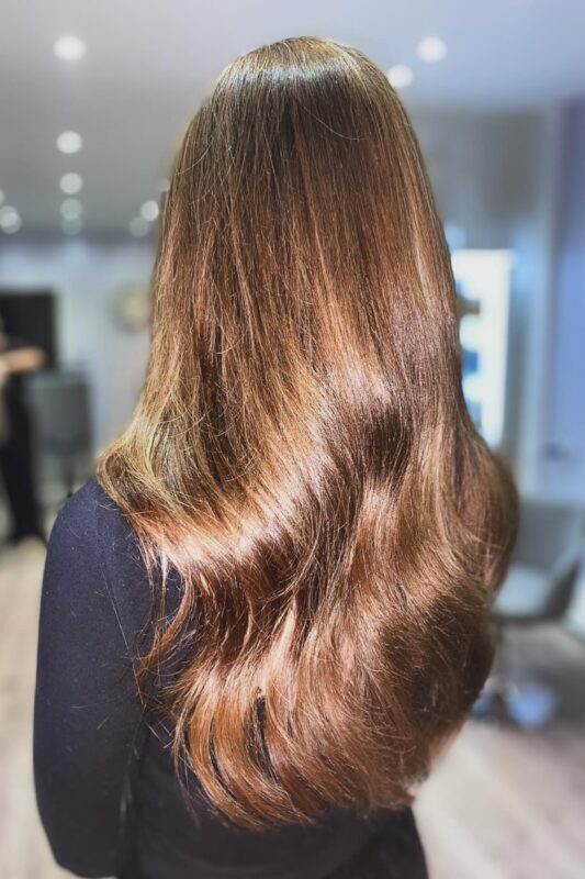 Woman with golden chestnut brown hair.