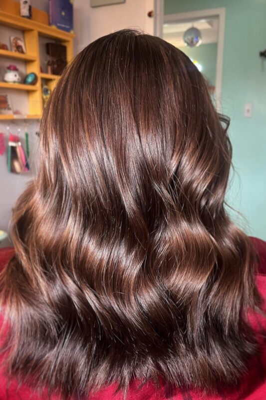 Woman with golden dark brown hair.