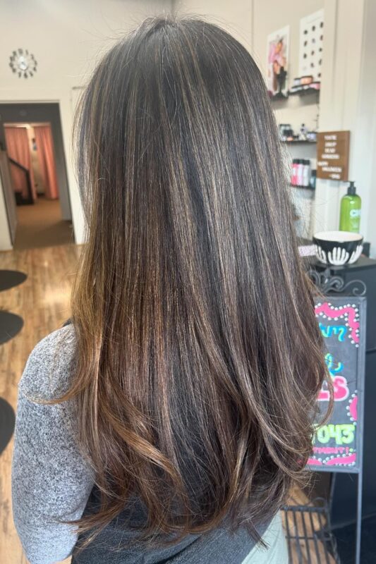 Golden grey blending balayage with a natural, sun-kissed effect.