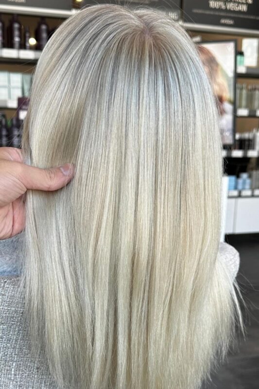 Woman with icy blonde highlights.