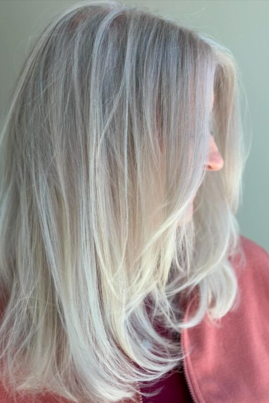 Icy blonde highlights for a sleek way to hide gray on blonde hair.