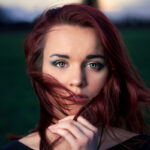 Woman with a red mahogany hair color.