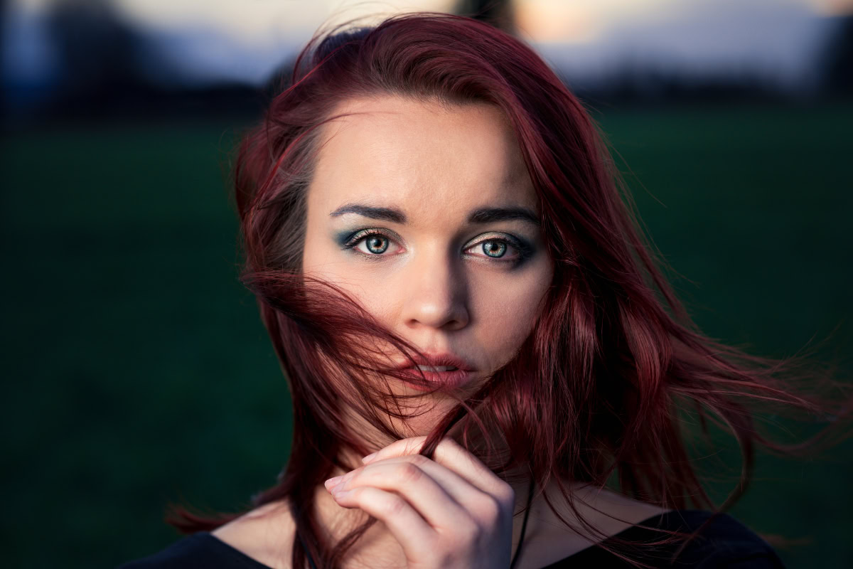 Woman with a red mahogany hair color.