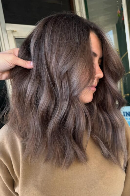 Woman with a mushroom brown hair color.