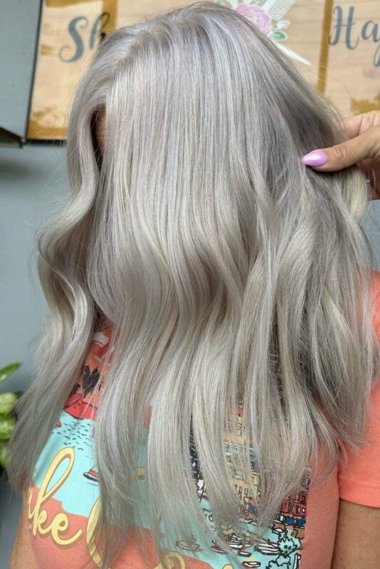 Woman with a cool blonde and grey blend.