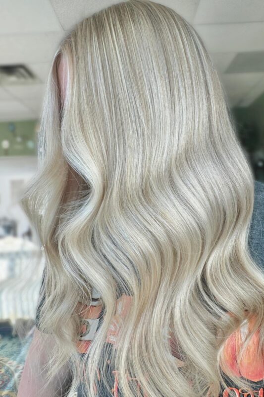 Woman with creamy cashmere blonde hair.