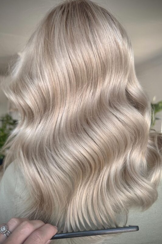 Woman with champagne blonde highlights.